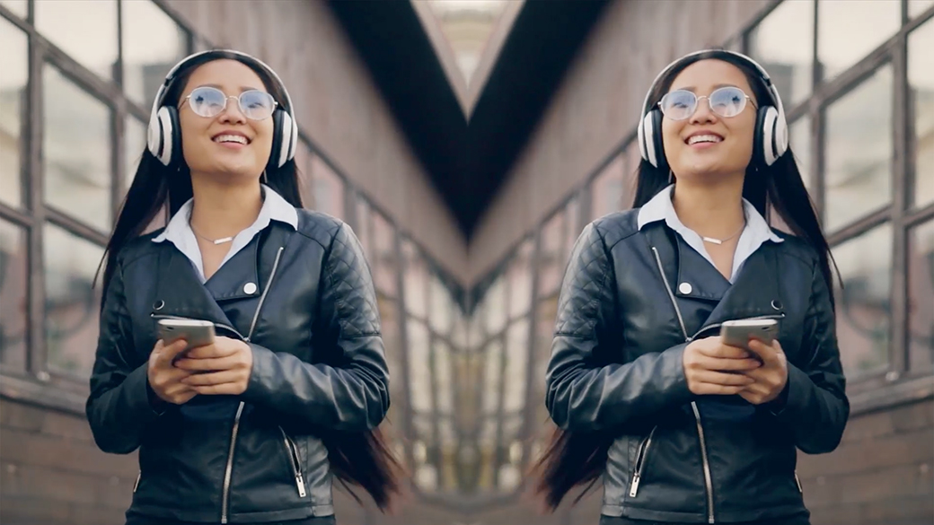 Female listening to music on her headphones