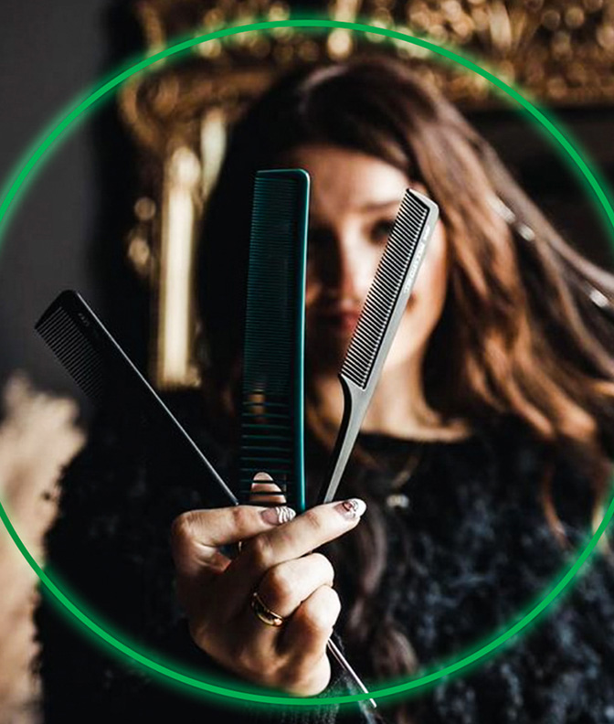 Paul Mitchell Schools Student holding combs in foreground to show confidence in her tools.
