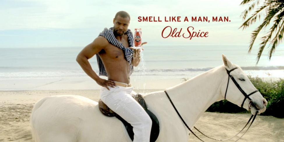 Campaign image from Old Spice of a man on a white horse with the text "Smell like a man, man. Old Spice"